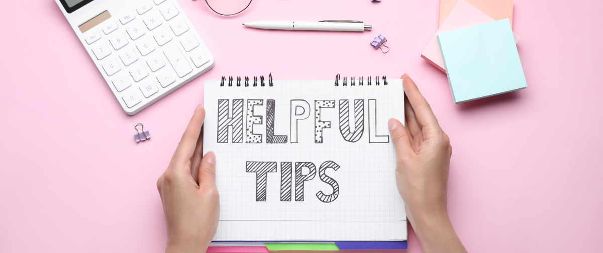 the words Helpful Tips written on a notepad on top of a pink table